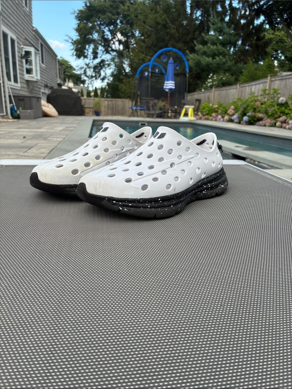 Men's White Athletic Slip-On Shoes with Black Speckled Sole